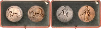 three antique silver and gold plated medallions of a woman and a man