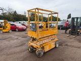 a yellow scissor that is parked in a parking lot