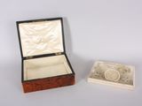a box with a watch inside of it on a table