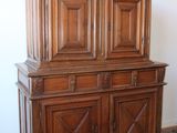 a large wooden cabinet in the corner of a room