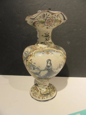 a vase that is sitting on a white table