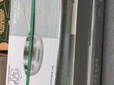 a shelf that has a bunch of books on top of it