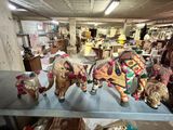 many figurines that are on a shelf in a room