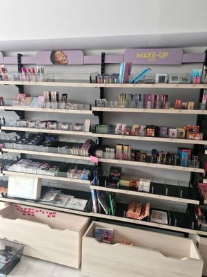 many shelves of cosmetics and makeup products in this store