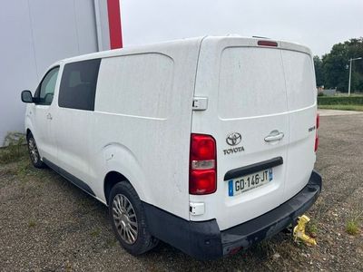 a white van that is parked in a parking lot