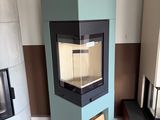 three different types of wood burning stoves in this room