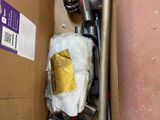 a box with a vacuum and other items inside of it