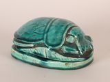 turquoise glazed figurine of a beetle on a leaf