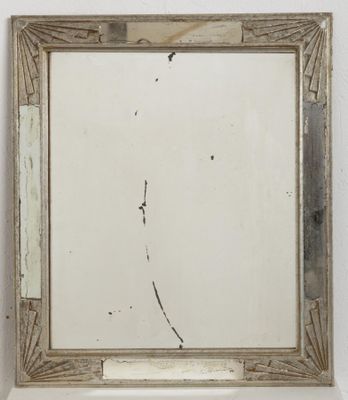 an image of a mirror hanging on a wall in a room