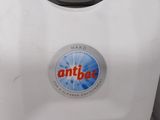 a white and gray machine with an antea sticker on it