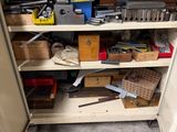 a small cabinet with many tools in it