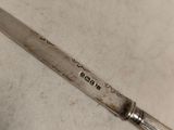 a knife that is laying on a table