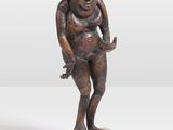 an image of a statue of a man holding a baby