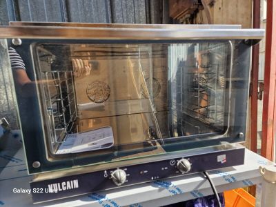 an oven that is sitting on top of a table