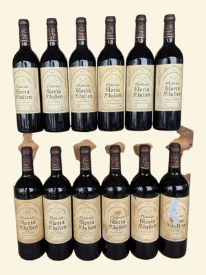 six bottles of wine are lined up in a row on a table