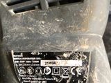 a close up of a machine that has a lot of dirt on it