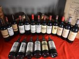 several bottles of wine are lined up on a table