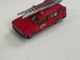 a red fire truck with a ladder on top of it