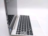 a laptop computer sitting on top of a white table