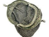 an antique silver mesh purse with a metal handle