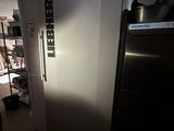 an image of a refrigerator in a kitchen with the door open
