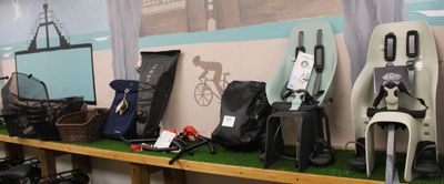 many different types of bags on a shelf in a room