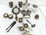 a lot of silver objects on a table