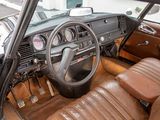 dashboard of a car with brown leather seats and steering wheel
