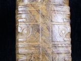 an image of a piece of stone with carvings on it