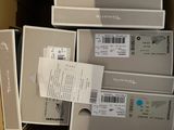 boxes of electronic devices are stacked on top of each other in a cardboard box