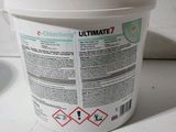 a white bucket with a label on it sitting on a table