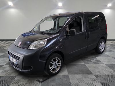 a picture of a small black van on a checkered floor