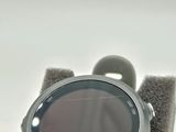 a close up of a smart watch on a stand