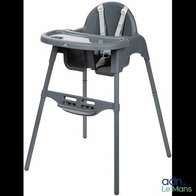 the high chair is gray and has a tray on it