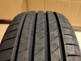 a close up view of a tire on a white surface