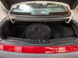 a trunk of a car with a bag in it