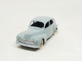 a toy car that is sitting on a white surface