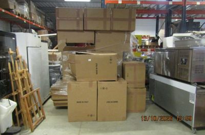 many boxes stacked on top of each other in a warehouse
