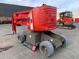 a red crane that is parked in a parking lot