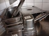 many pans and pans on the counter in the kitchen