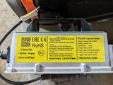 a yellow sticker on the back of a motorcycle