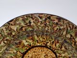 a brown and green bowl with rice in it