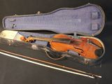 a violin in a case with a bow in it