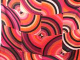 a close up of a multicolored scarf on a white background