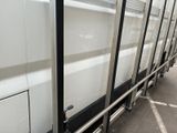 an image of a white truck parked in a parking lot