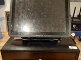 an image of a laptop computer sitting on top of a cash register