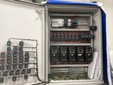 a metal cabinet with a bunch of electrical equipment inside of it