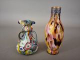 two vases sitting next to each other on a table