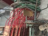 a stack of chairs sitting on top of a wooden pallet