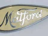 an image of a metal badge with the word mattrool on it